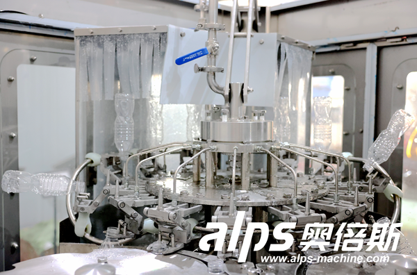 Automatic Water Filling Line – Filling Nozzles Dispensing Water into PET Bottles