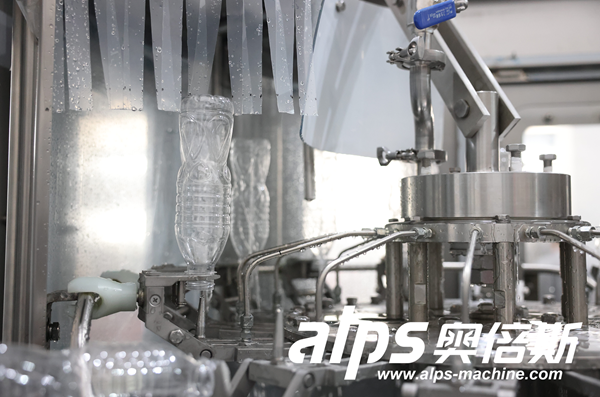 Close-Up of Water Filling Line – Precision Filling Nozzle in Action
