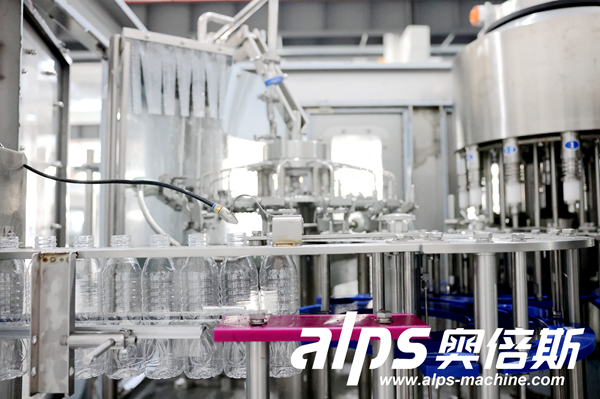 Water Production Line – PET Bottles on Conveyor Before Capping